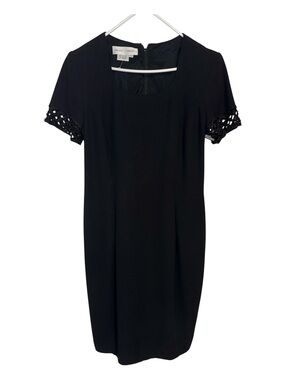 Maggy London Black pleated Midi dress. Lined. Size 10.  Beaded short sleeve.